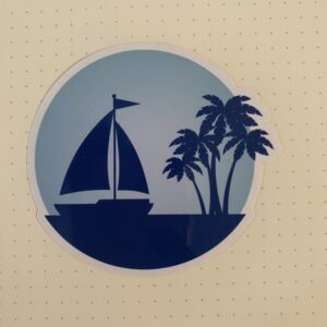 Silhoutte of Sailboat and several palm trees against light blue background.