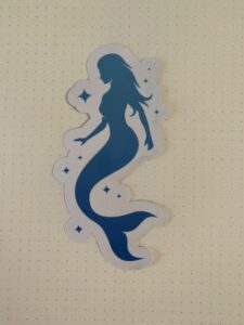 Mermaid silhoutte on white background with Starts.