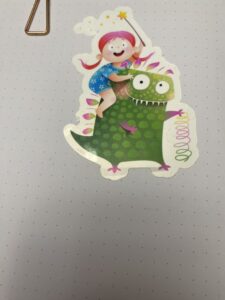 Pink haired girl riding piggy back on a green, polka-dotted monster's back.